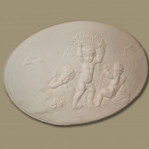 Triple cherub plaque with garland