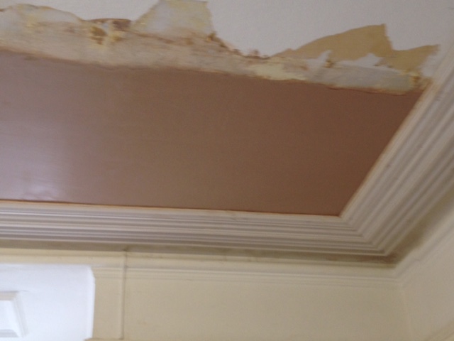 water damaged ceiling being restored with new plastering
