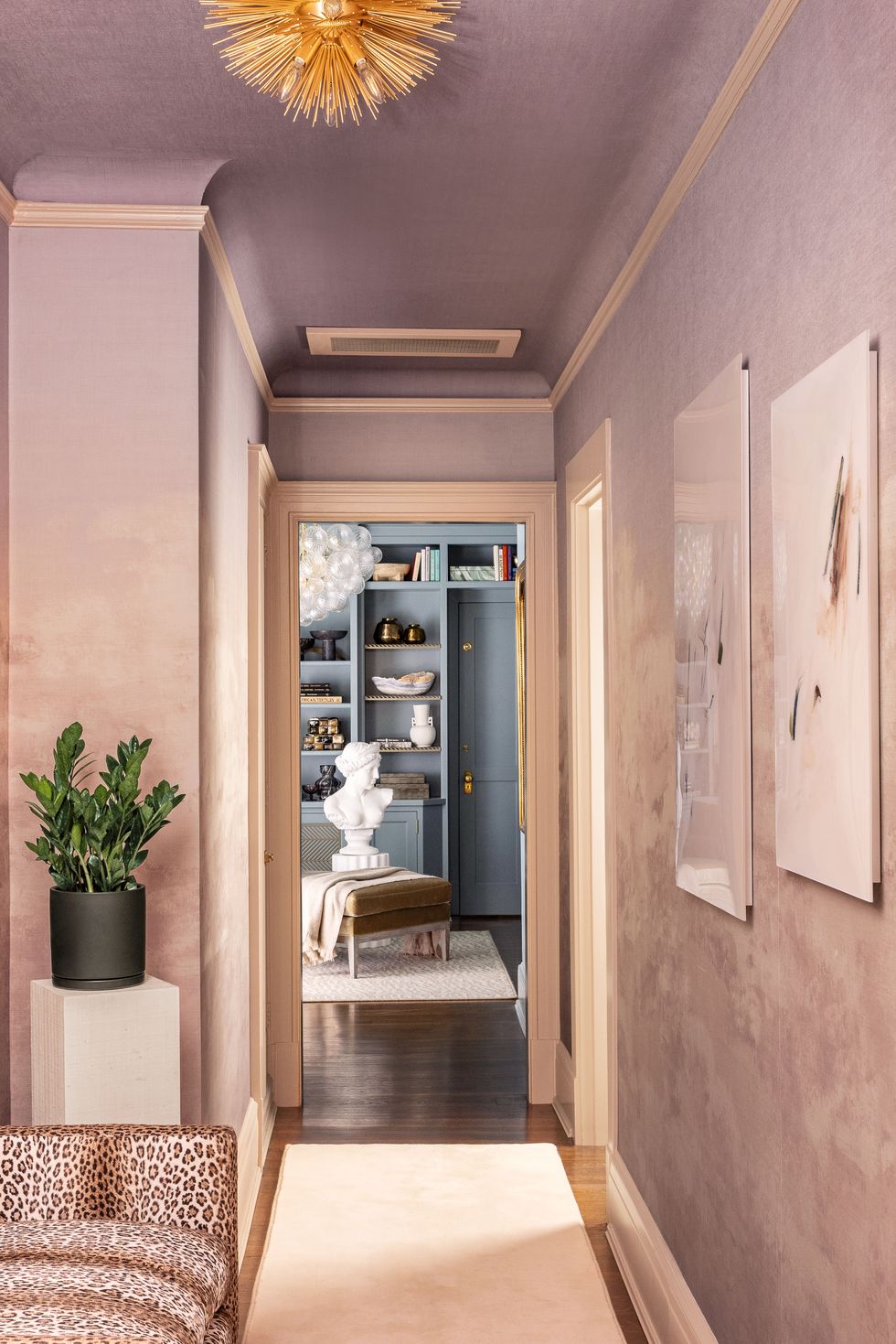  In this remarkable display by designer Rasheeda Grey, a breathtaking ombré wallcovering from Phillip Jeffries, inspired by the captivating hues of a sunset, demonstrates how a combination of pinks can evoke a sophisticated ambiance. 